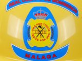 a yellow helmet with a picture of a fireman on it