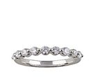 a close up of a diamond ring on a white background