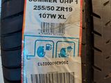 the tire of a car with a sticker on it ' s side