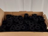 a cardboard box filled with black sprinkles on a table