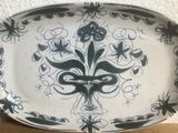a black and white plate with a decorative design on it