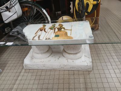 a table with a glass top that has a picture of a horse on it