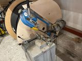 a machine that is sitting in a garage next to a box