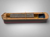a model of a boat on a gray surface