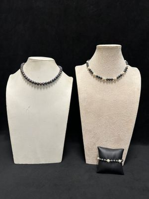 a couple of mannequins that are sitting next to each other