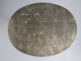 a round metal object with a hole in the middle of it