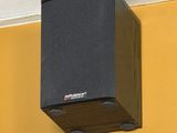a picture of a speaker mounted on the ceiling