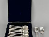 silverware in a black case with six spoons and two spoons