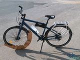 a bicycle that is parked on the side of the road
