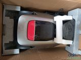 a small car in a box with the lid open