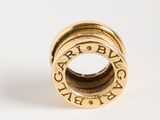 an image of a gold plated ring with the word ' paris place ' engraved on it