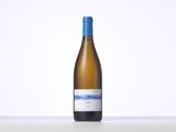 a bottle of white wine sitting on top of a table