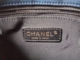 a close up of a black bag with a tag on it