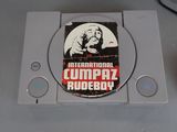 a video game console with a game on top of it
