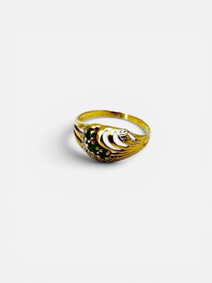 a close up of a gold ring with green stones on it