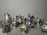 a lot of silver items that are on a table