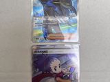 three different pokemon trading cards in plastic cases on a table