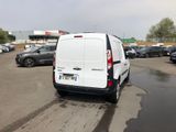 a white van that is parked in a parking lot