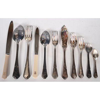 a lot of silver spoons and forks on the table