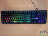 a computer keyboard that is sitting on a table