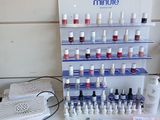 a display of nail polish bottles and tools on a counter