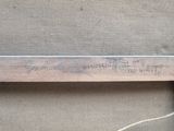 a picture of a piece of wood with writing on it