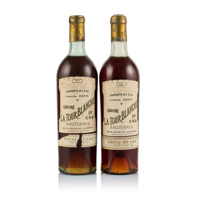 two bottles of bourbon are sitting next to each other on a white surface