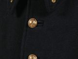 a close up of a black coat with gold buttons