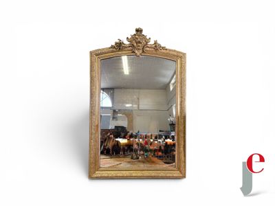 a mirror that is sitting on the wall in the room