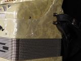 a close up of an old accordion on a black background