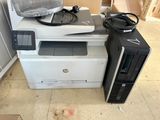 a computer and printer sitting on top of each other
