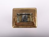 a small clock that is sitting on top of a table