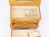 a small wooden box with a mirror on top of it