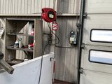 a man that is standing in front of a machine