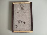 a picture of a picture of a book with a ring on it