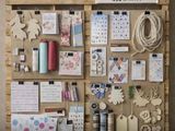 a picture of a bulletin board with lots of craft supplies on it