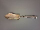 a silver spoon with a silver handle on a table