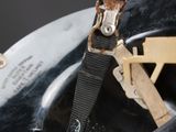 a close up of a helmet with a strap on it