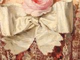 a painting of a woman wearing a dress with a rose on it