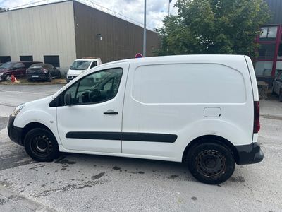 the white van is parked in the parking lot