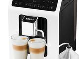 a close up of a coffee machine with two cups of coffee
