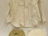 a white shirt, pants, and a white shirt on a table