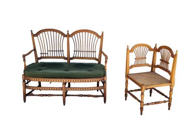 two chairs and a bench that are sitting next to each other