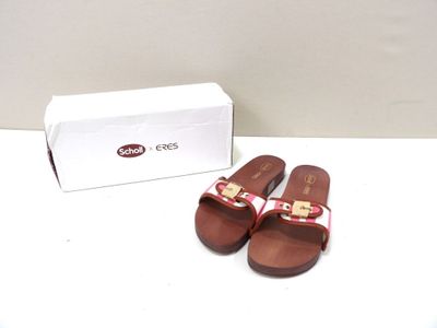 pair of red and white sandals with a box on a white surface