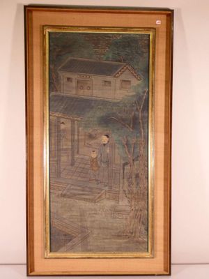 tableau encadré représentant une maison avec un homme sous le porche