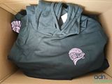 a shirt in a box with a hoodie on it