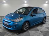a blue citrole is parked in a room with a checkered floor