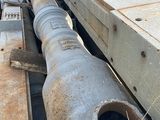 a large pipe on the side of a train track