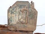 an old rusted metal box with a handle on top of it