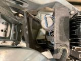a close up of a motorcycle engine with wires attached to it